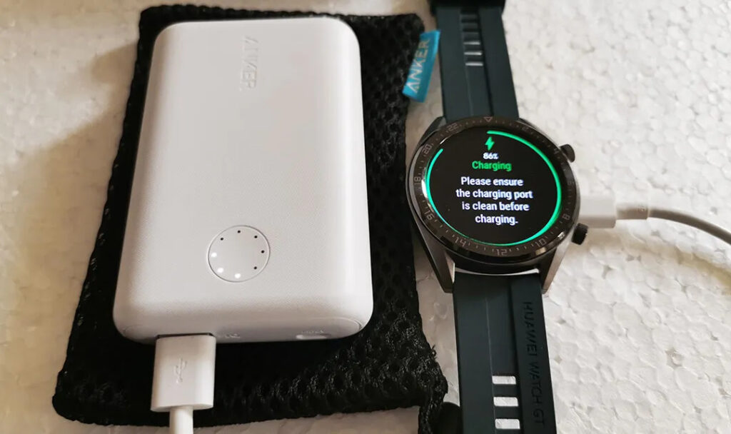 Charging a smartwatch with a power bank.